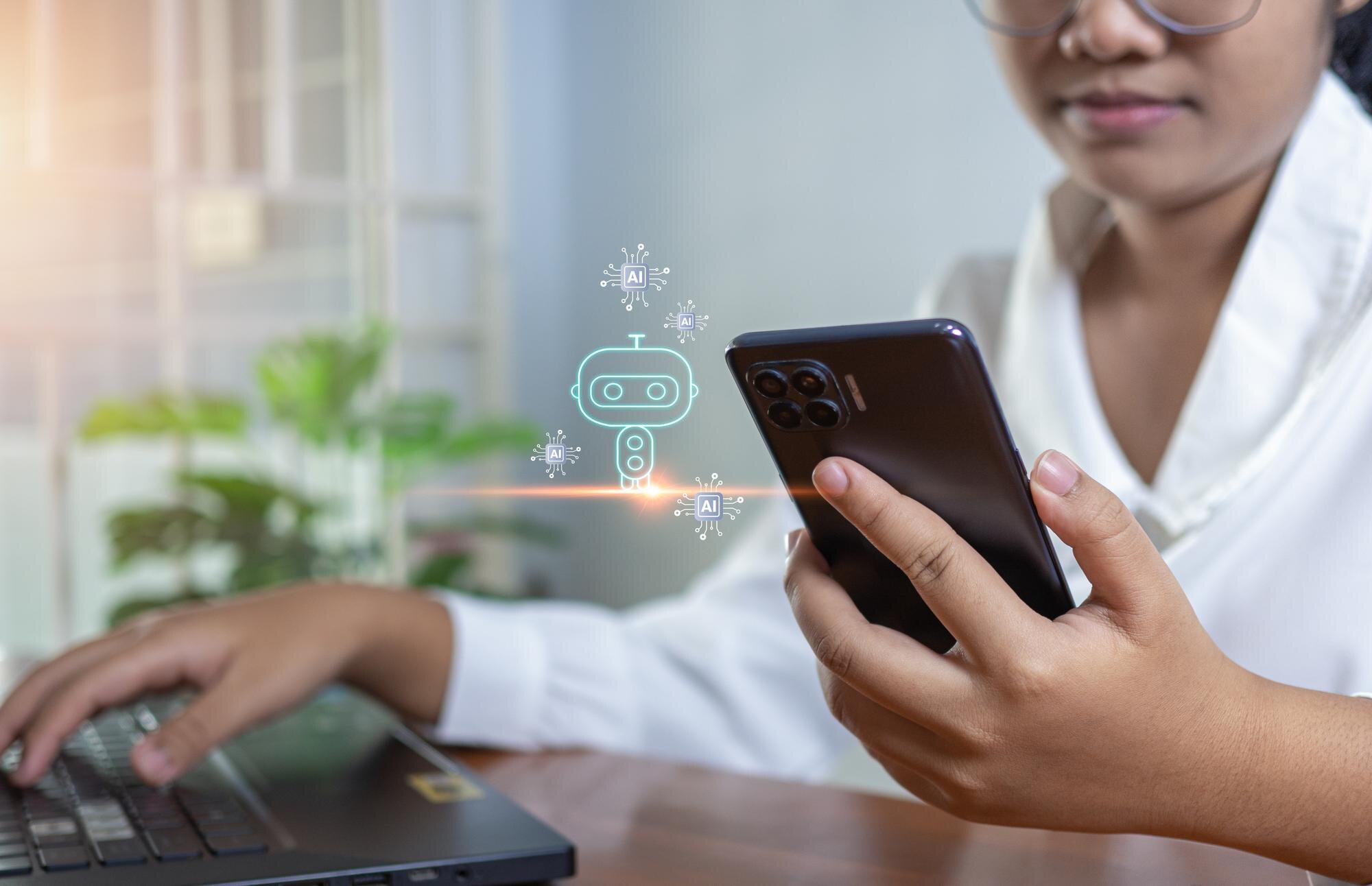 Affärskvinna använder en AI-chattbot på datorn, som illustration till GPT-5.5 Instant som personlig standardmodell i ChatGPT